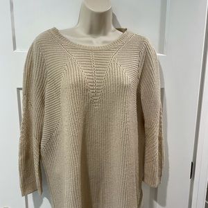 Cream colored sweater, light weight.